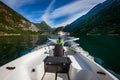 Man driving a motor boat. Geiranger fjord, Beautiful Nature Norway.Summer vacation Royalty Free Stock Photo