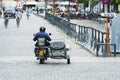 A man driving a motorcycle with sidecar