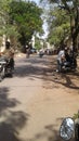 Man driving motorcycle in the street of maharashtra, India