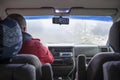 Man driving by narrow mountain road with heavy fog Royalty Free Stock Photo