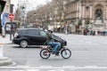 Man driving an old Peugeot SPX moped on the street