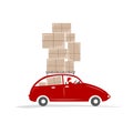 Man driving red car with boxes on the roof rack Royalty Free Stock Photo