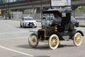 Man driving Retro Ford Model R car in downtown Vancouver, British Columbia, Canada