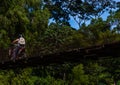 Man driving riding over old bridge in Guatemalan Mountains Royalty Free Stock Photo