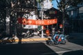 Man driving a scooter in the streets of old neighborhoods of Shanghai's Former French Concession