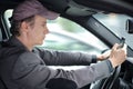 Man driving and texting someone on his cell phone Royalty Free Stock Photo