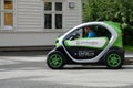 Man driving very small eco car on tour in Flam