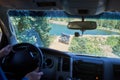 Man driving a 4WD along a dirt road Royalty Free Stock Photo