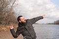 Man dropping a stone into the river Royalty Free Stock Photo