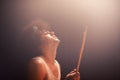 Man, drummer and musician in performance at rock concert, music festival on stage and talent. Person, artist and play on Royalty Free Stock Photo