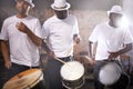 Man, drums and group band playing with instrument at festival, carnival or night party with lens flare. Male person Royalty Free Stock Photo