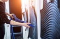 Man drying car carpet with vacuum cleaner after washing Royalty Free Stock Photo