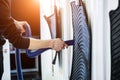 Man drying car carpet with vacuum cleaner after washing Royalty Free Stock Photo