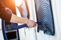 Man drying car carpet with vacuum cleaner after washing Royalty Free Stock Photo