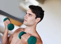 Man, dumbbells for weightlifting and fitness, muscle training for strong body and self care in apartment. Topless Royalty Free Stock Photo