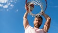 man dunking basketball ball through net ring with hands, copy space, male basketball Royalty Free Stock Photo