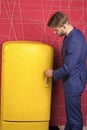 Man on duty near fridge. Stop being hungry. Beginning of diet. On guard your diet. Guy handsome formal suit near fridge