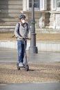 Man on e-scooter with mask