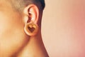 Man with earlobe hole. Royalty Free Stock Photo