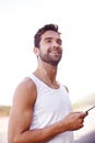 Man, earphones and phone on road for running, music and motivation for cardio or training for marathon. Person Royalty Free Stock Photo