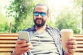 Man with earphones and smartphone drinking coffee Royalty Free Stock Photo