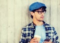 Man with earphones and smartphone drinking coffee Royalty Free Stock Photo