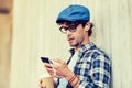 Man with earphones and smartphone drinking coffee Royalty Free Stock Photo