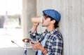 Man with earphones and smartphone drinking coffee Royalty Free Stock Photo