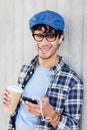 Man with earphones and smartphone drinking coffee Royalty Free Stock Photo