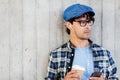 Man with earphones and smartphone drinking coffee Royalty Free Stock Photo