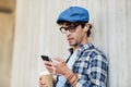 Man with earphones and smartphone drinking coffee Royalty Free Stock Photo