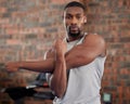 Man, earphones or stretching arms in gym workout, training or exercise for health, wellness or strong muscles. Portrait Royalty Free Stock Photo