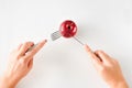 Girl eating apple with fork and knife top view.healthy food concept. Healthy products, fruits on a white background. vegetarianism Royalty Free Stock Photo