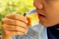 Man eating bake bread, butter Royalty Free Stock Photo