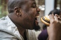 Man eating a big hamburger Royalty Free Stock Photo