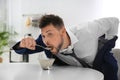 Man eating breakfast in hurry. Morning preparations