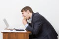 Man eating burger at desk Royalty Free Stock Photo