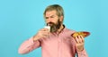 Man eating cookies and drinking milk. cookie and a glass of milk. happy farmer eat cookie dessert. bearded man drink