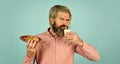man eating cookies and drinking milk. cookie and a glass of milk. happy farmer eat cookie dessert. bearded man drink