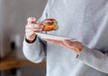 Man eating donut on breakfast at kitchen Royalty Free Stock Photo