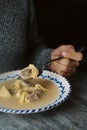 Man eating escudella de Nadal typical of Catalonia