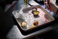 The man is eating fast food in a cafe. A table by the window. Empty dirty dish. Dinner. Cloth napkin Royalty Free Stock Photo