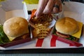 Man eating fries at a fast food restaurant.