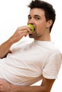 Man eating green apple Royalty Free Stock Photo