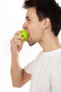 Man eating green apple Royalty Free Stock Photo
