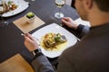 Man eating grilled salmon at restaurant Royalty Free Stock Photo