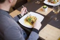 Man eating grilled salmon at restaurant Royalty Free Stock Photo