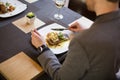 Man eating grilled salmon at restaurant Royalty Free Stock Photo