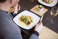 Man eating grilled salmon at restaurant Royalty Free Stock Photo