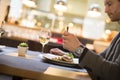 Man eating grilled salmon at restaurant Royalty Free Stock Photo